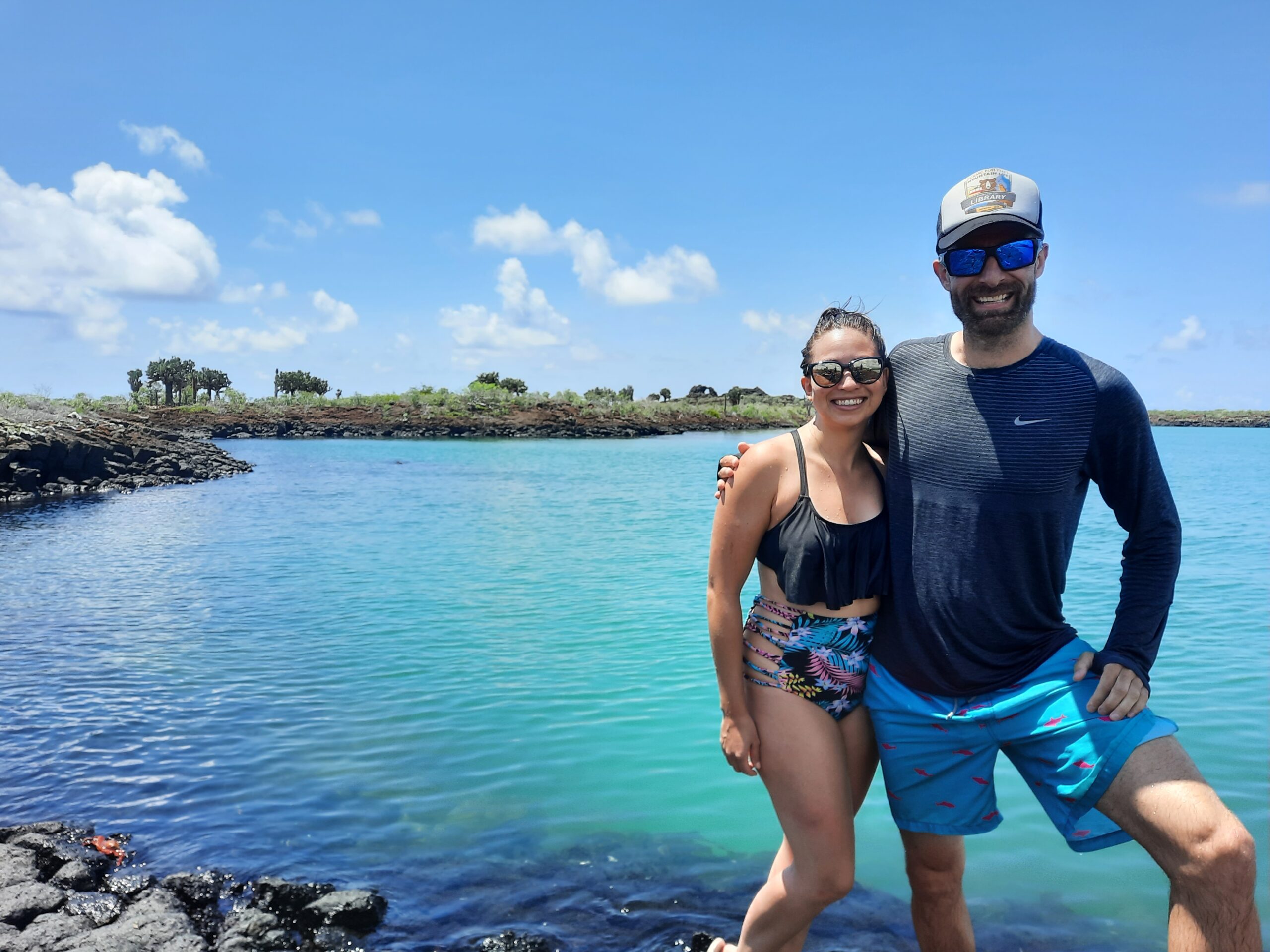 Two tourists in Bahia Rosa Blanca on the trip to the 360  tour, San Cristobal - Galapagos Islands